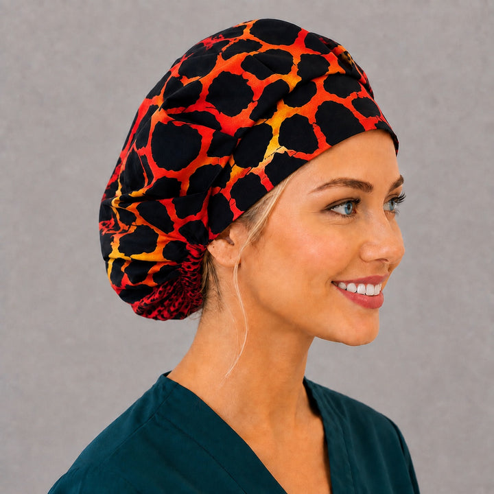 Animal print cheetah bouffant scrub cap, left side profile — bold spotted print for OR nurses and surgical techs