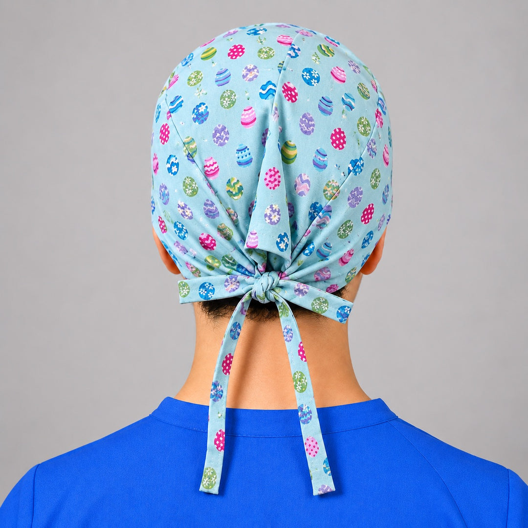 Rear knot with long ties on aqua Easter egg scrub hat, adjustable fit shown from behind
