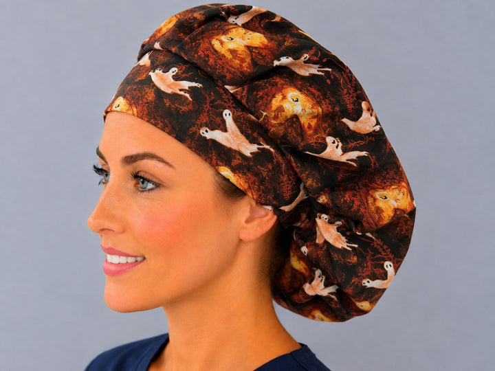 Autumn ghost bouffant scrub cap with harvest moon print, angled view — roomy elastic-back cap for OR nurses and surgical techs