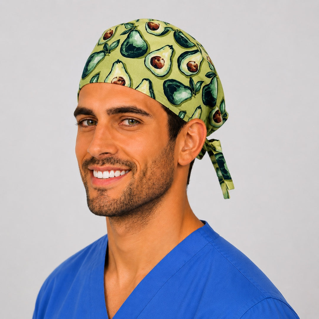 Sage green avocado Mexican food scrub cap on a smiling male nurse, side view showing the tie-back