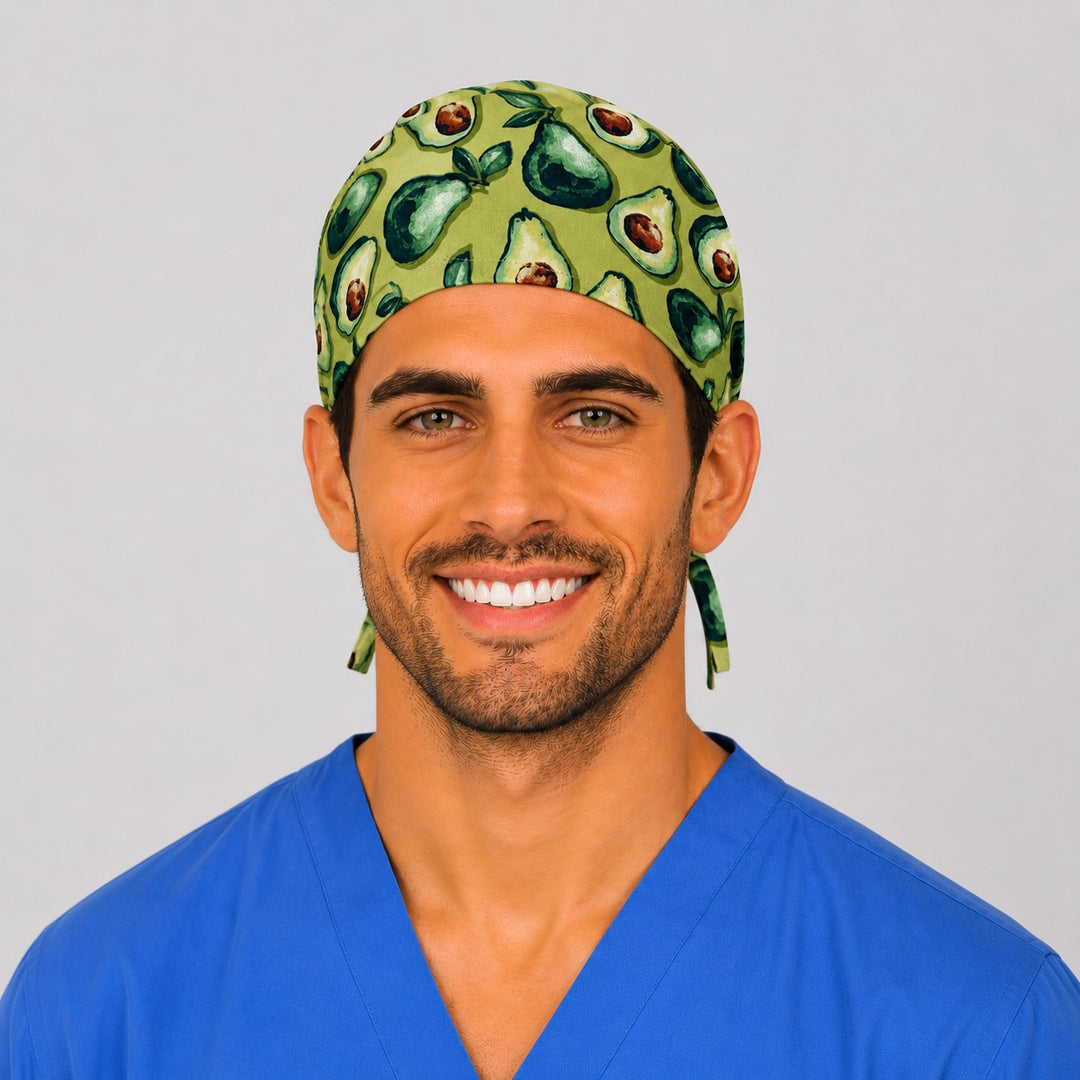 Man wearing a sage green avocado print tie-back scrub cap, front view — OR World handmade foodie surgical hat