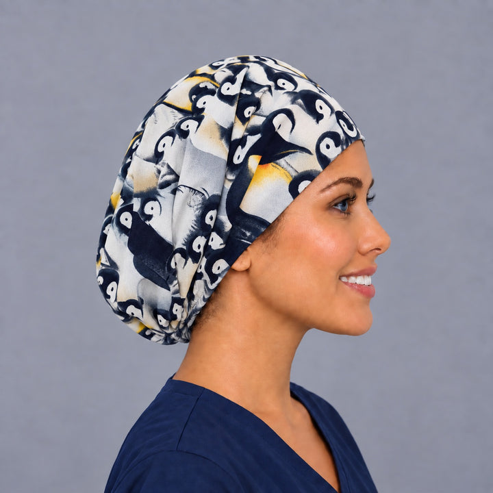 Right side profile of the baby penguin Euro surgical hat — fluffy penguin chick print, breathable cotton cap for OR nurses
