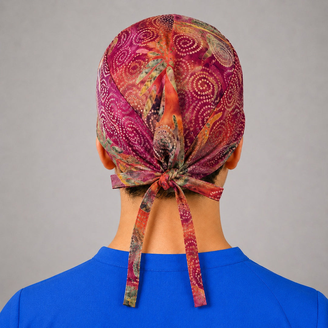 Rear knot detail on batik tie back scrub hat, unisex closure that adjusts to fit all head sizes