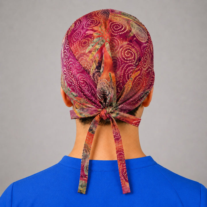 Rear knot detail on batik tie back scrub hat, unisex closure that adjusts to fit all head sizes