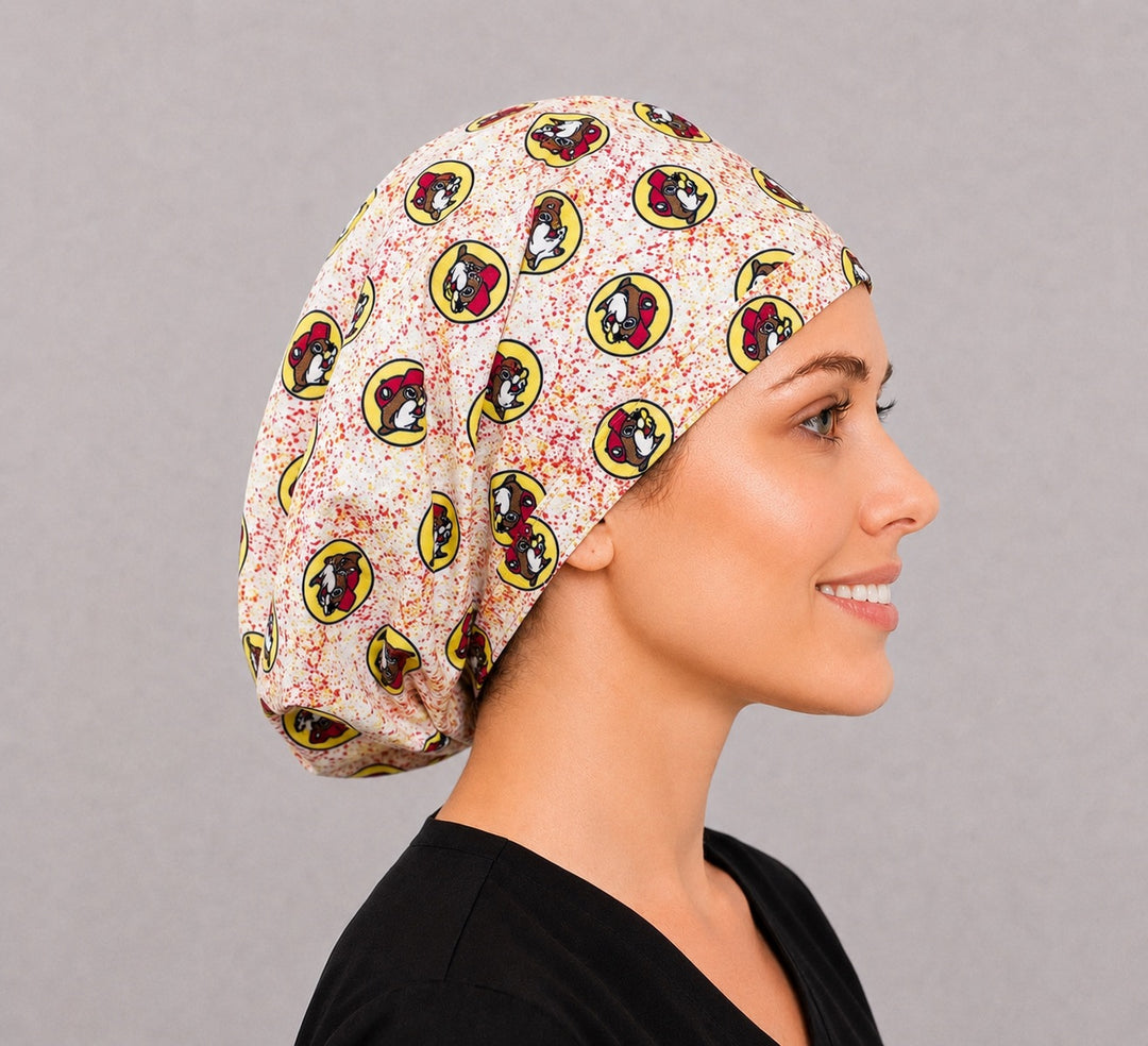Beaver Euro scrub cap, right side profile — red and gold paint splatter print for OR nurses and vet teams