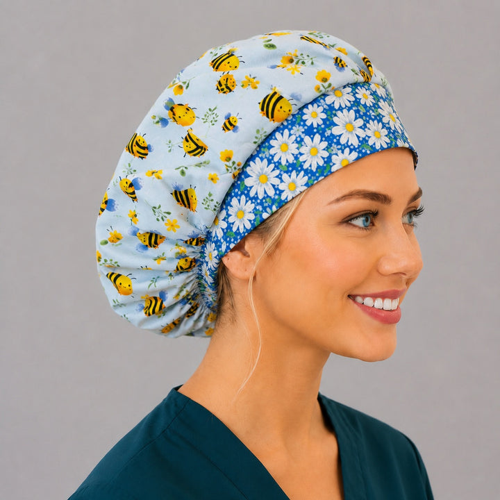 Woman wearing a cute bee bouffant scrub cap with daisy band, front view — cartoon bumblebees and wildflowers with blue daisy band, adjustable women&