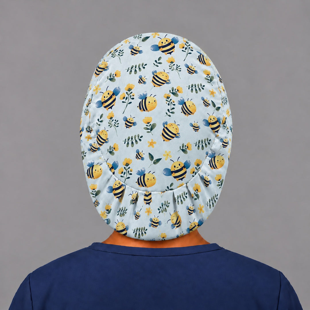 Back view of the bee euro scrub cap, showing the oval crown panel and evenly pleated elastic band hugging the base of the head