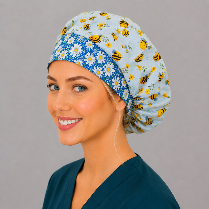 Back view of the bee floral bouffant scrub cap — full roomy fit with cartoon bumblebees, wildflowers and a daisy band elastic gather