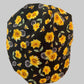 Bee Grateful bouffant scrub cap with golden sunflowers & honeybees on black, front view — handmade-in-USA surgical hat for women from OR World.