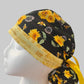 Bee Grateful ponytail scrub cap with sunflowers, bees & yellow script band, front view — handmade-in-USA surgical hat for women with long hair from OR World.