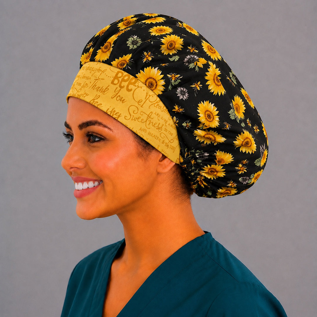 Bee Grateful sunflower bouffant scrub cap left side profile showing golden sunflowers, honeybees and yellow bee grateful script band, women&