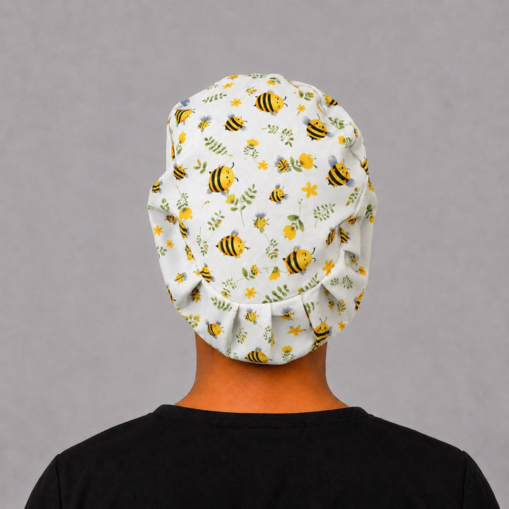 Back view of Bee Happy Blooms honeybee Euro scrub cap with elastic toggle fit — handmade-in-USA OR World surgical hat for women.