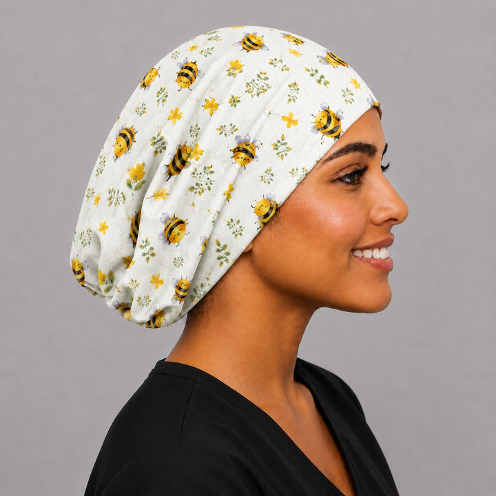 Side view of Bee Happy Blooms honeybee Euro scrub cap on a model — handmade USA surgical hat for OR nurses with room for long hair.