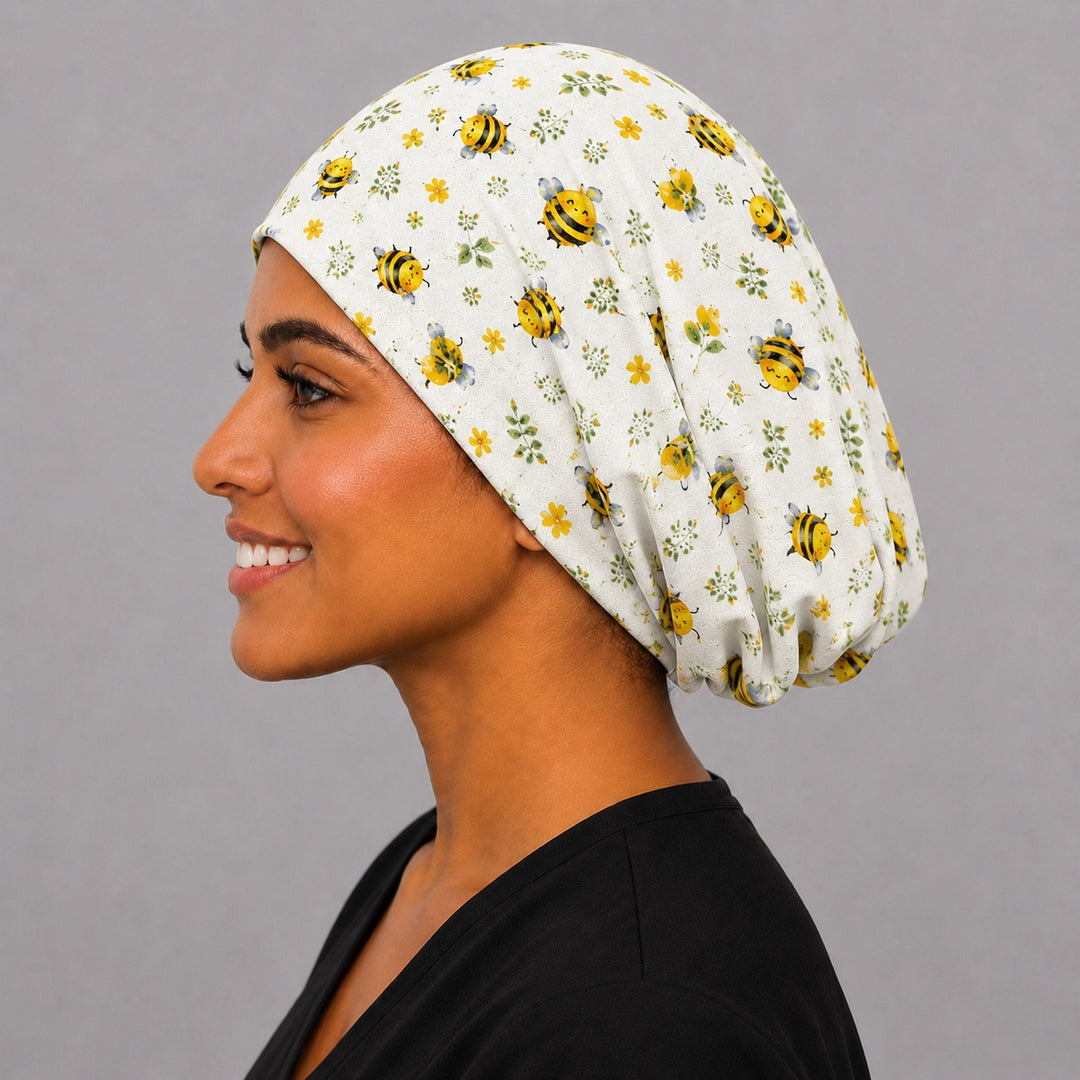 Profile view of Bee Happy Blooms honeybee floral Euro scrub cap — handmade-in-USA surgical hat, cheerful gift for nurses &amp; bee lovers.