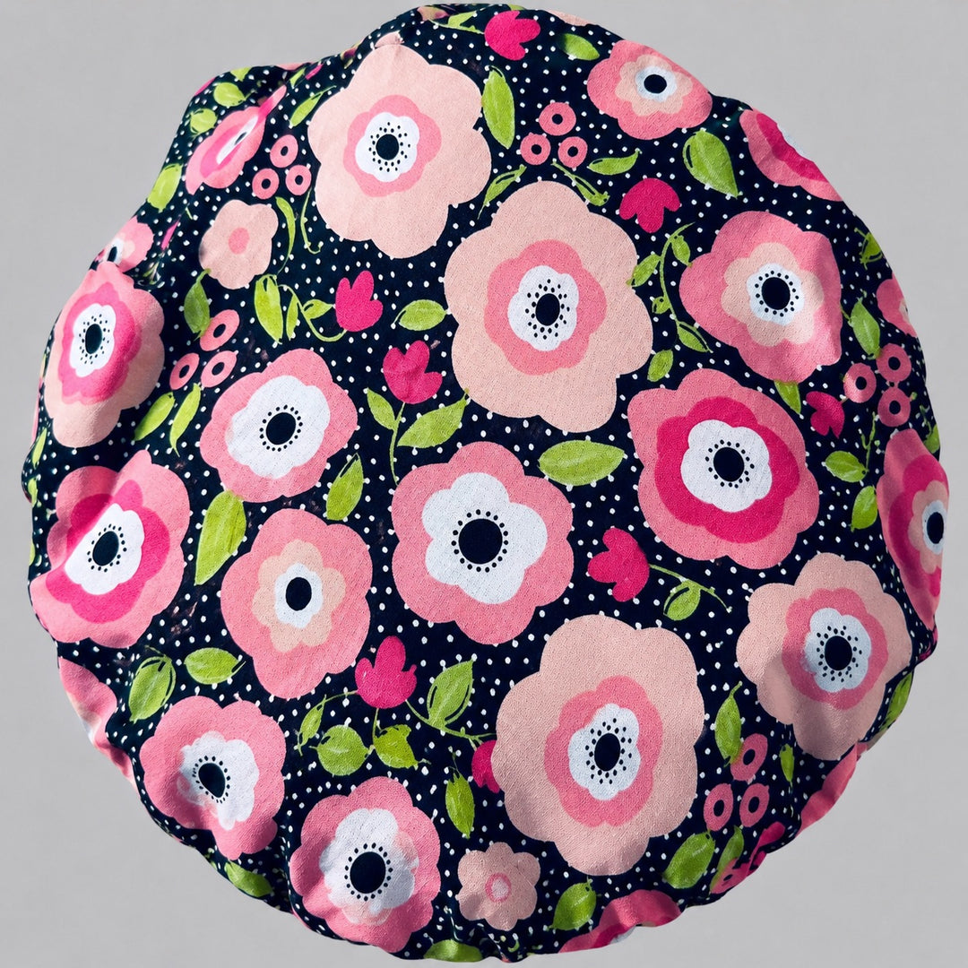 Side view of the black polka dot floral bouffant surgical hat — pink poppies with a dotted contrast band, roomy cotton cap for nurses