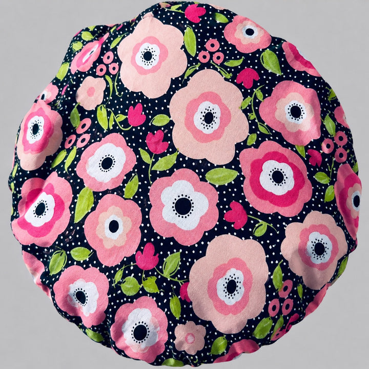 Side view of the black polka dot floral bouffant surgical hat — pink poppies with a dotted contrast band, roomy cotton cap for nurses