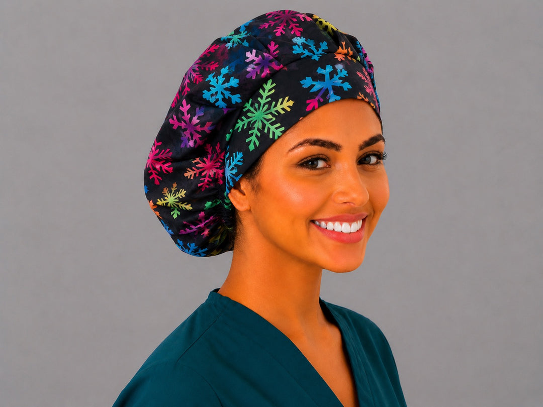 Black and rainbow snowflake bouffant cap for women, right angled view — handmade winter holiday surgical cap, USA made