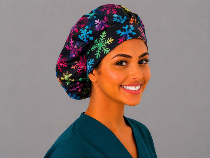 Black and rainbow snowflake bouffant cap for women, right angled view — handmade winter holiday surgical cap, USA made