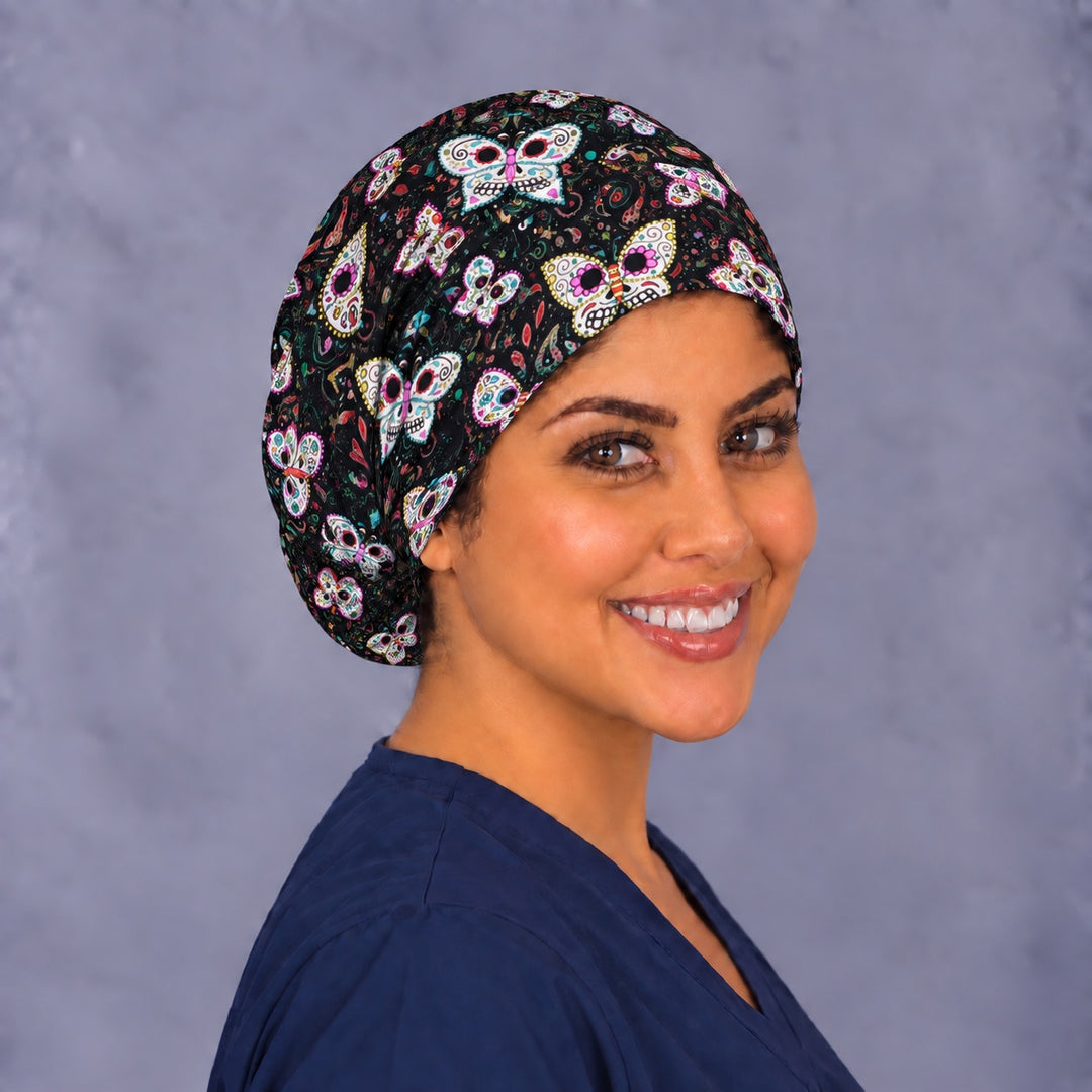 Black sugar skull Euro surgical cap, left angled view — elastic adjustable back that secures long or thick hair