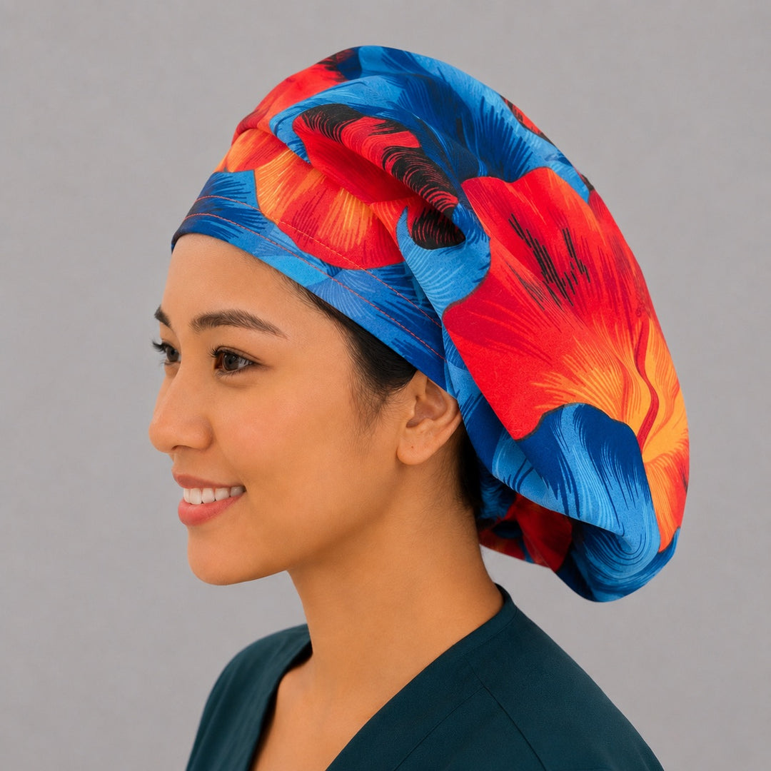 Blue and orange Hawaiian hibiscus bouffant scrub cap back view showing full print of vivid blue red and orange hibiscus flowers, OR World tropical surgical hat