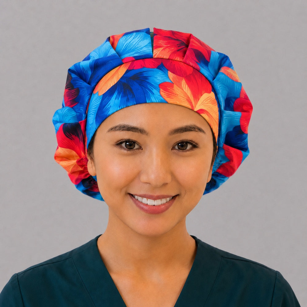 Blue and orange Hawaiian hibiscus bouffant scrub cap for women, front view, vivid blue red and orange hibiscus flowers, handmade tropical surgical hat by OR World