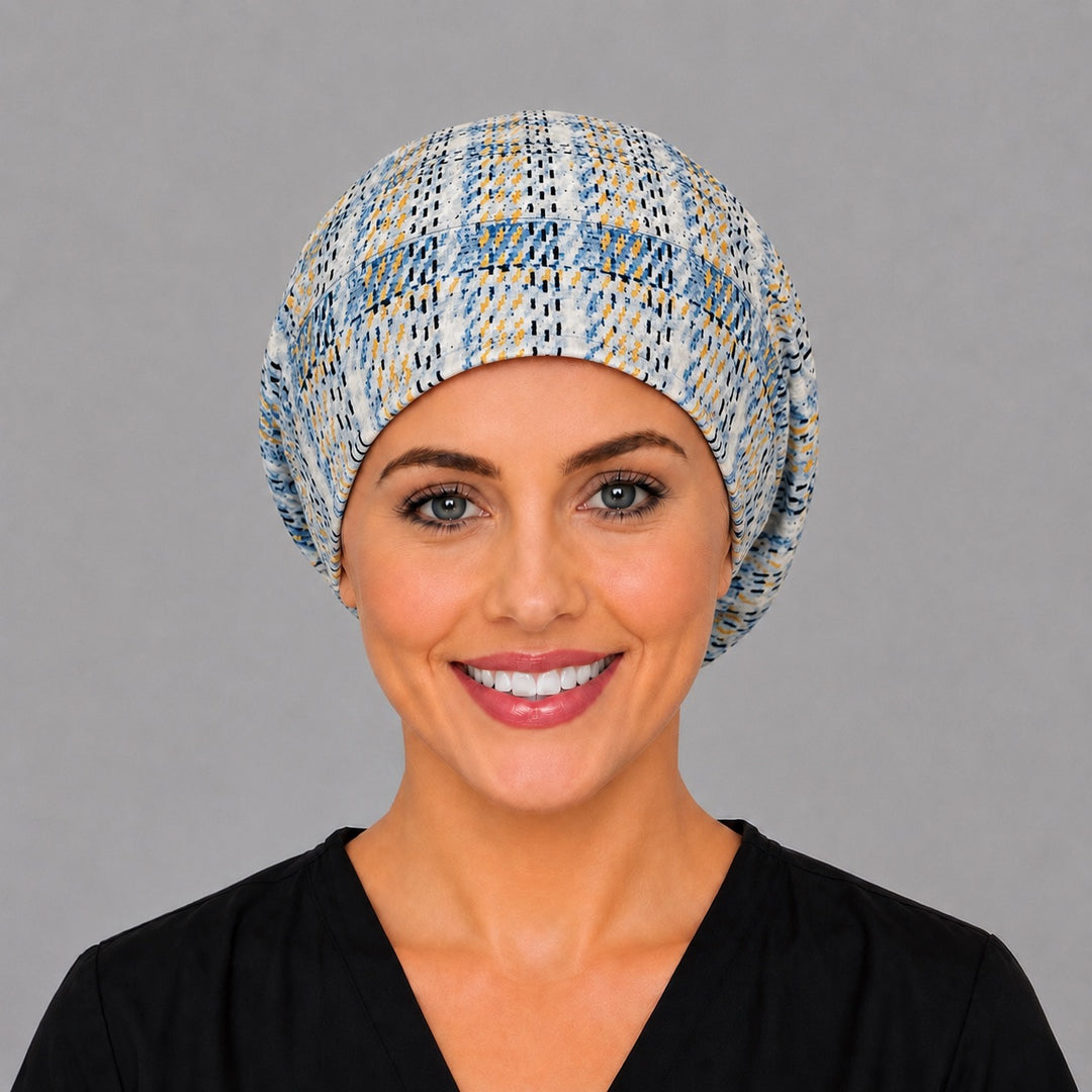 Woman wearing a blue plaid Euro scrub cap, front view — sky blue and gold plaid on cream, adjustable surgical hat for women and men