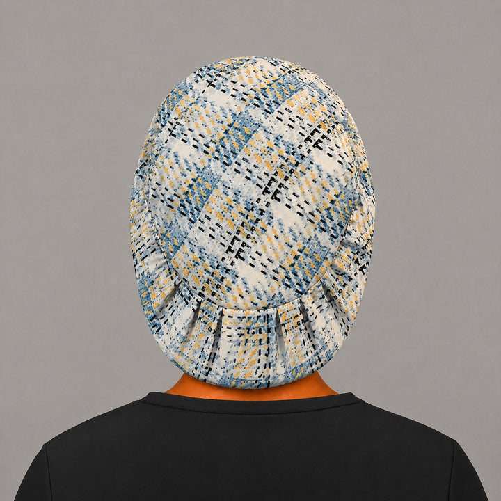 Back view of the blue plaid Euro scrub cap — elastic gathered back showing the blue and gold plaid across the crown