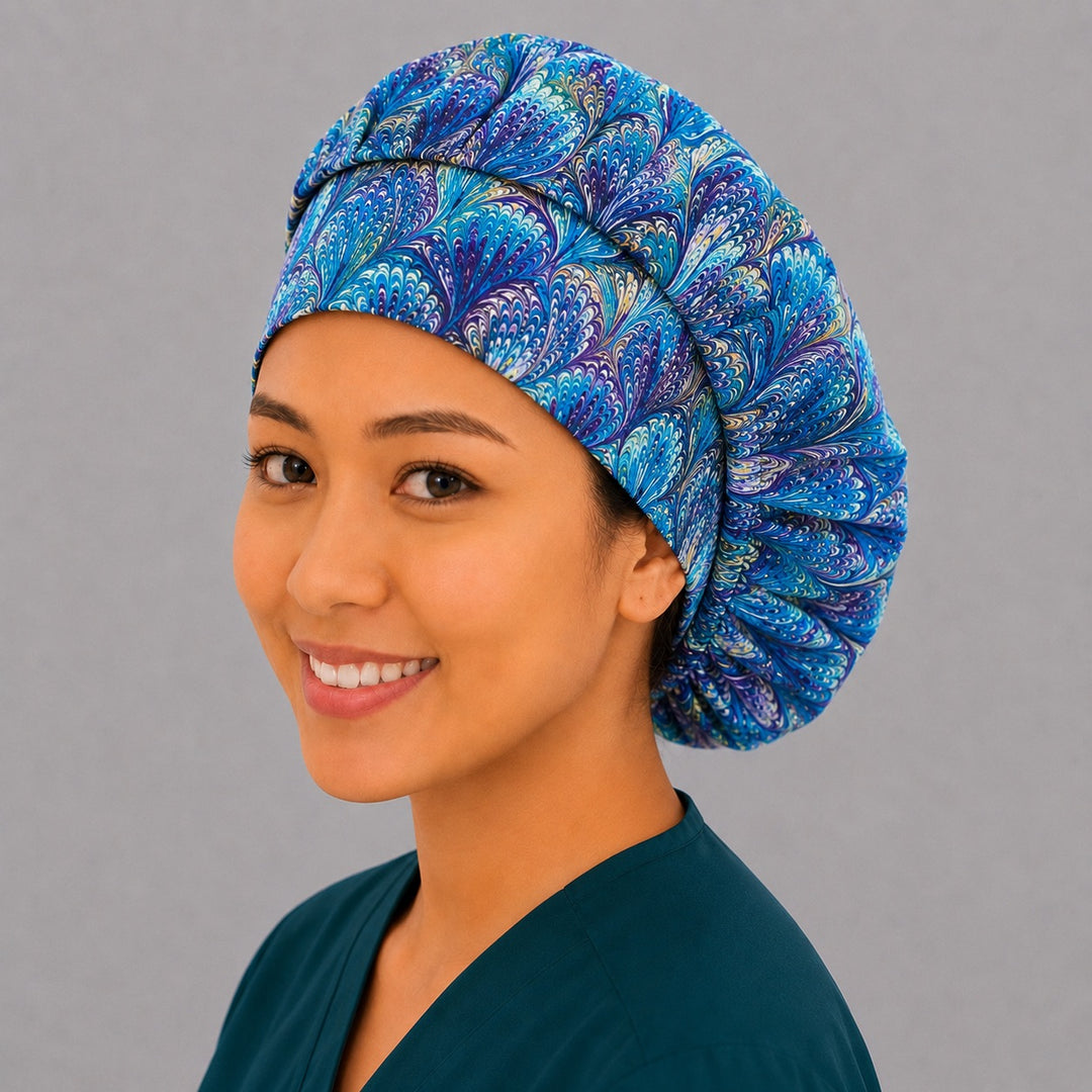 Blue and purple ripples bouffant scrub cap back view showing full marbled peacock swirl print in turquoise, blue and purple, OR World surgical hat