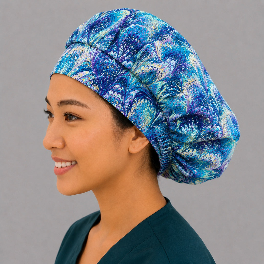 Blue and purple ripples bouffant scrub cap for women, front view, marbled peacock swirl print in turquoise, blue and purple, handmade surgical hat by OR World
