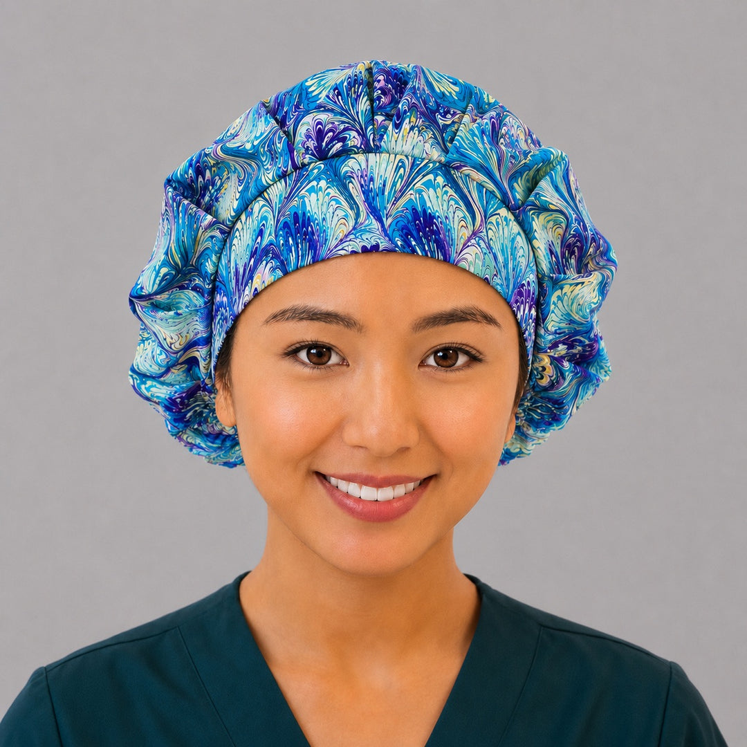 Blue and purple ripples bouffant scrub cap right side profile showing marbled peacock swirl print in blue purple and gold, women&