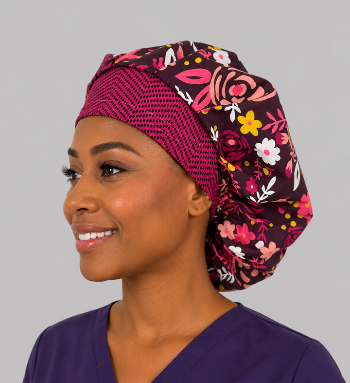 Angled view of the bold rose floral bouffant cap for women on a smiling L&amp;D nurse — handmade cotton surgical cap, USA made