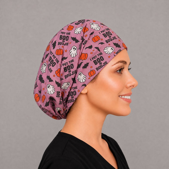 Back view of the I Put The Boo In Boujie Euro scrub cap — elastic gathered back showing ghosts and pumpkins across the pink crown