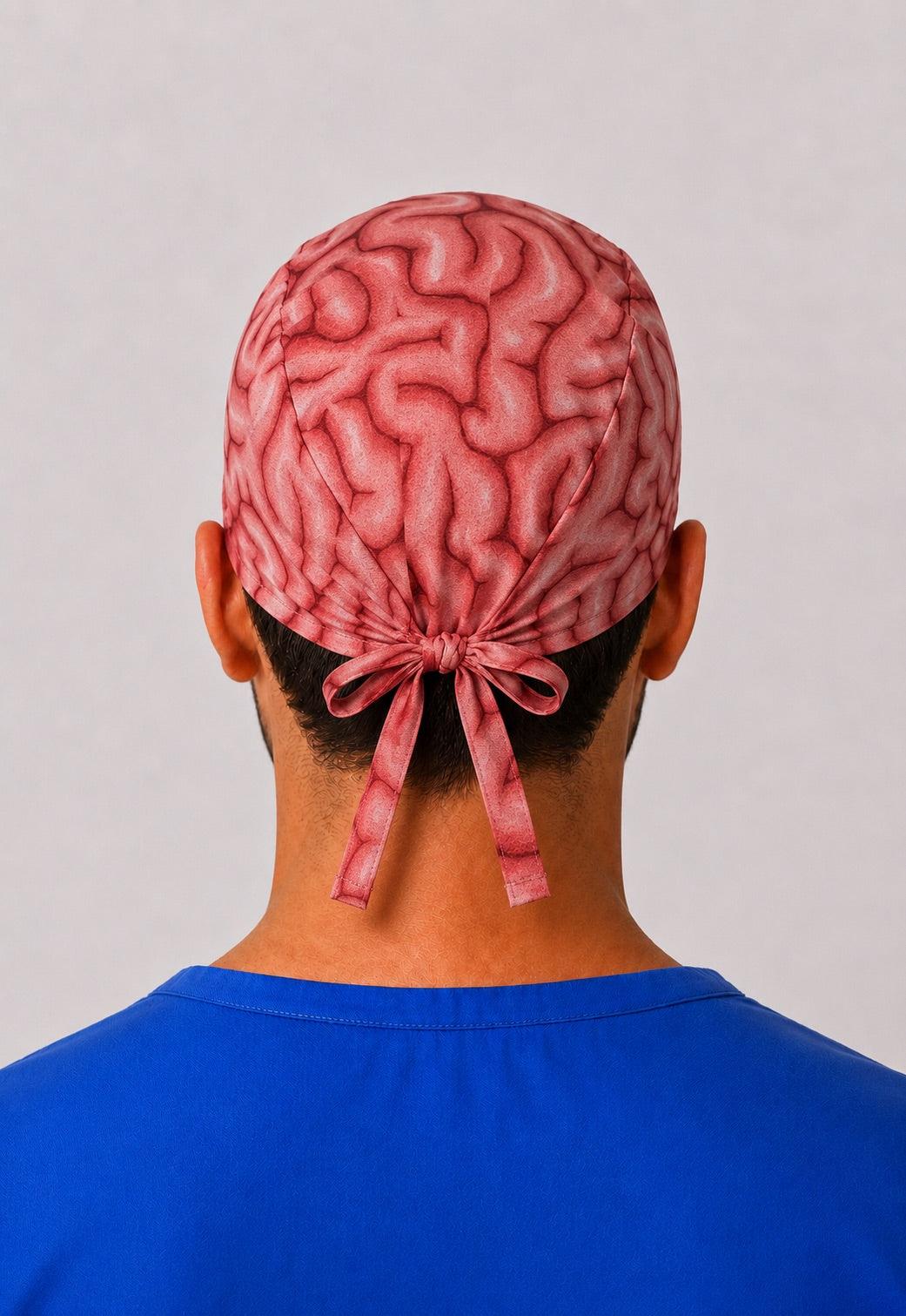 Back view of the brain anatomy tie-back scrub cap showing the bow tie closure and full brain print