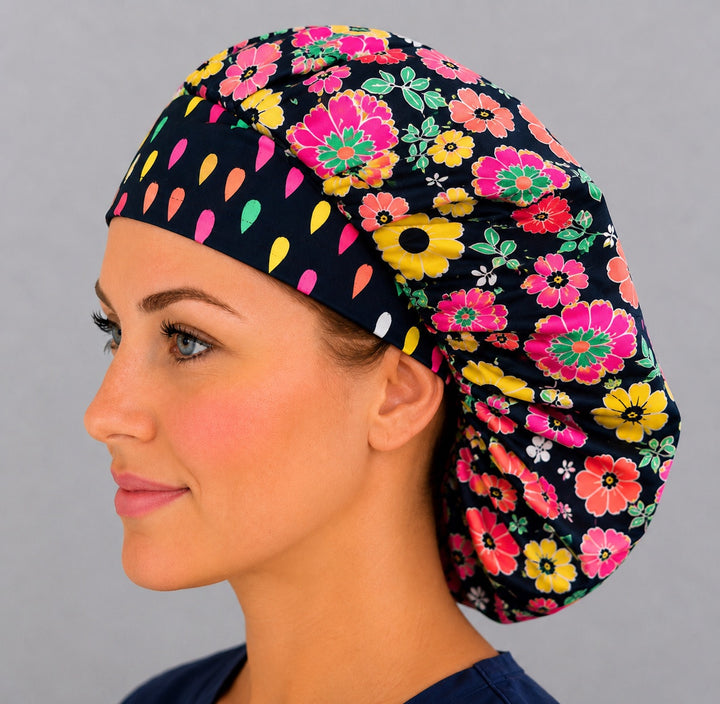 Bright floral neon flower bouffant scrub cap front band close-up on smiling model showing confetti-dot band and neon flowers on navy, OR World nurse hat
