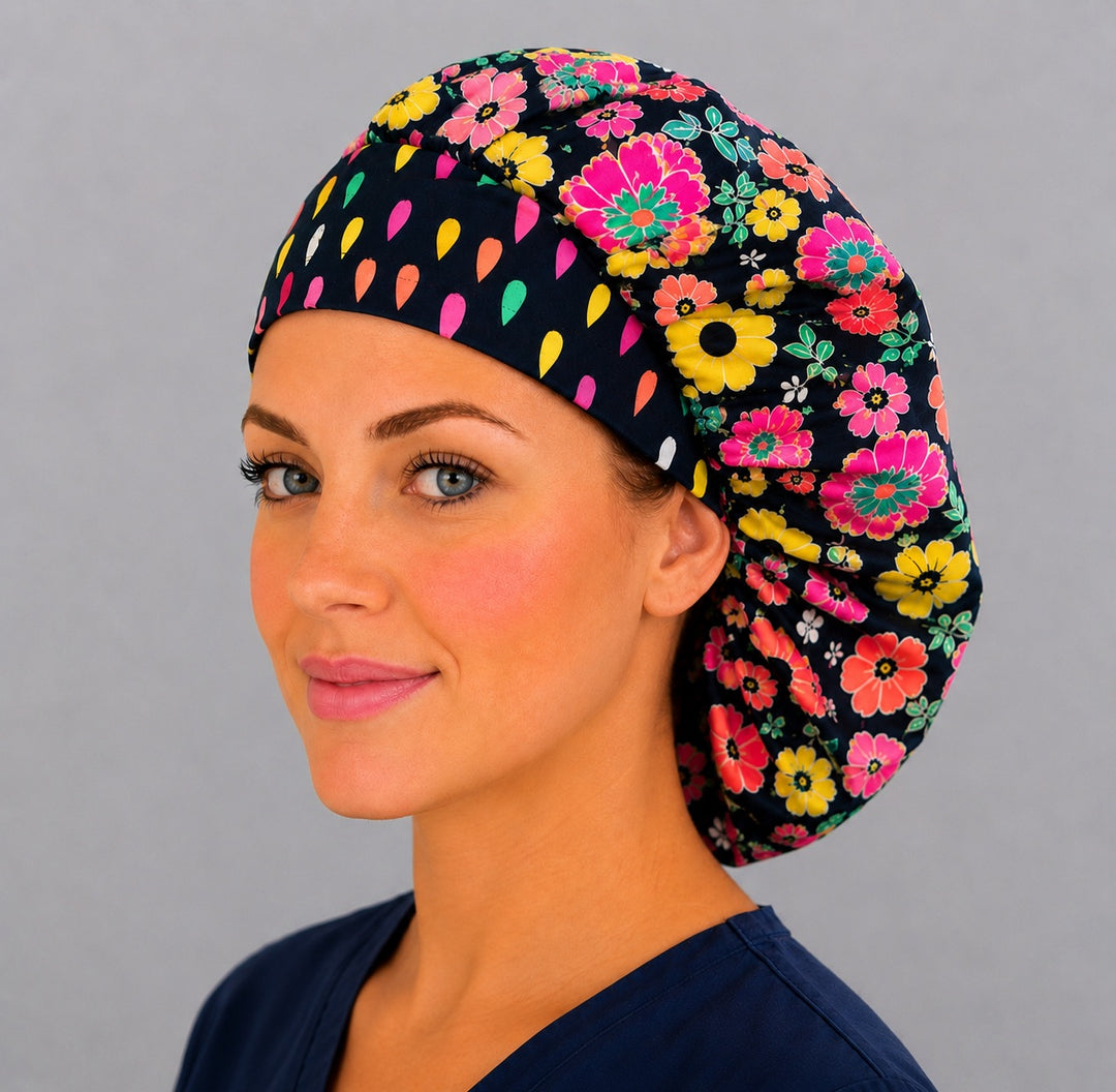 Bright floral neon flower bouffant scrub cap left side profile showing bold pink and yellow flowers on navy with confetti-dot band, OR World surgical hat