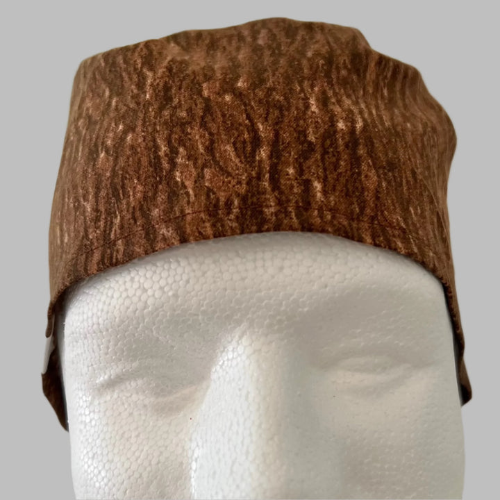 Brown rustic tree-bark scrub cap on a model — handmade-in-USA men&