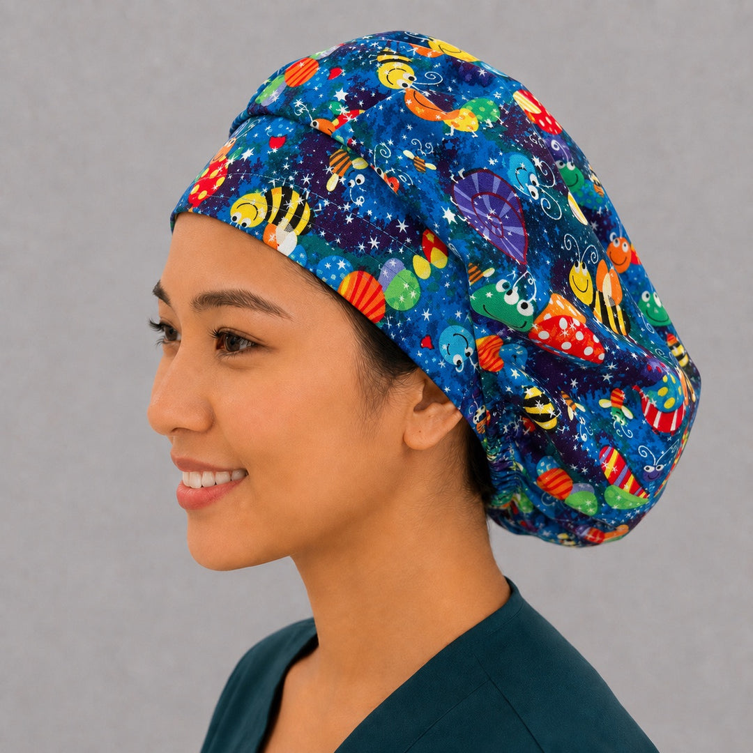 Bumblebee and dragonfly bouffant scrub cap angled smiling view — cheerful bug print cap, favorite for pediatric nurses