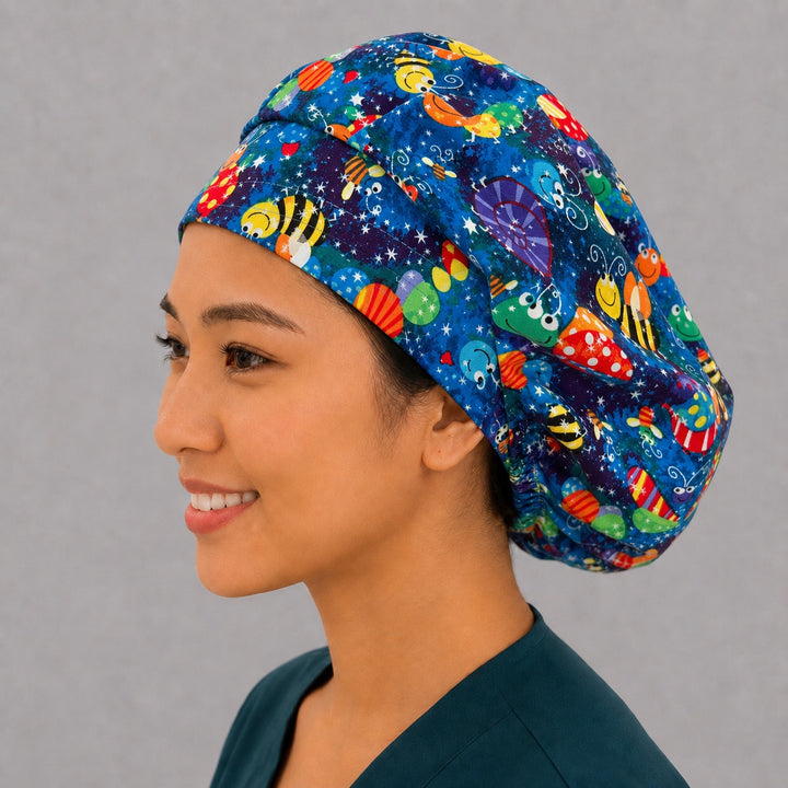 Bumblebee and dragonfly bouffant scrub cap angled smiling view — cheerful bug print cap, favorite for pediatric nurses