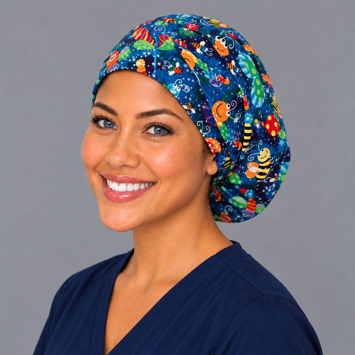Butterfly and bee Euro scrub cap, right angled smiling view — starry blue print for OR nurses and pediatric teams