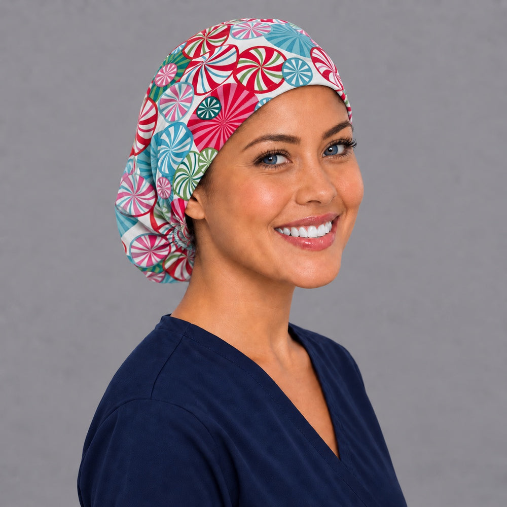 Candy swirl Euro scrub cap, right angled smiling view — teal and evergreen peppermint print for OR nurses and surgical techs