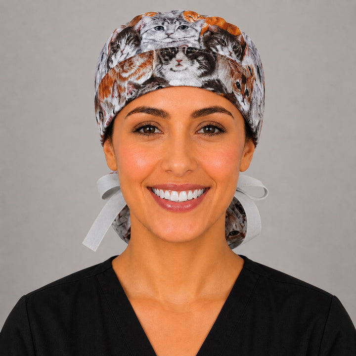 Cats and kittens ponytail scrub cap left profile view showing full ponytail pouch of realistic cats and long gray ribbon ties