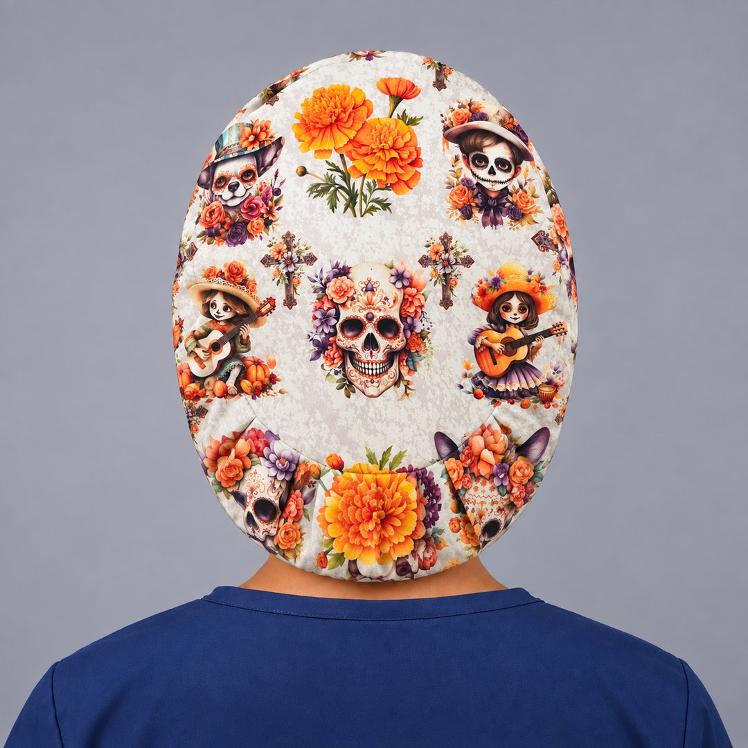 Back view of the cempasúchil Euro scrub cap with adjustable elastic band, sugar skull, marigolds and floral crosses on cream premium cotton