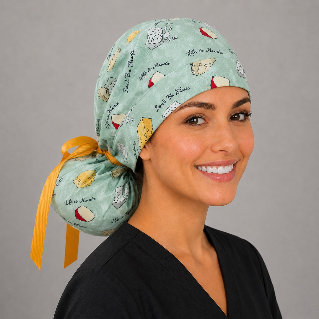 Funny cheese pun ponytail nurse cap right three-quarter angle on smiling model showing Life is Gouda and Don&
