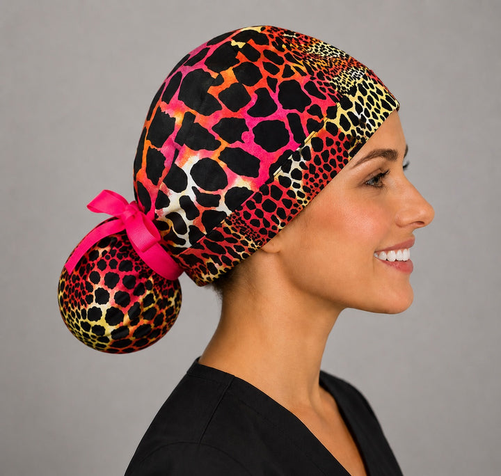 Neon cheetah leopard ponytail scrub cap back view close-up showing gathered pouch full of pink orange yellow and black leopard print with hot pink ribbon bow