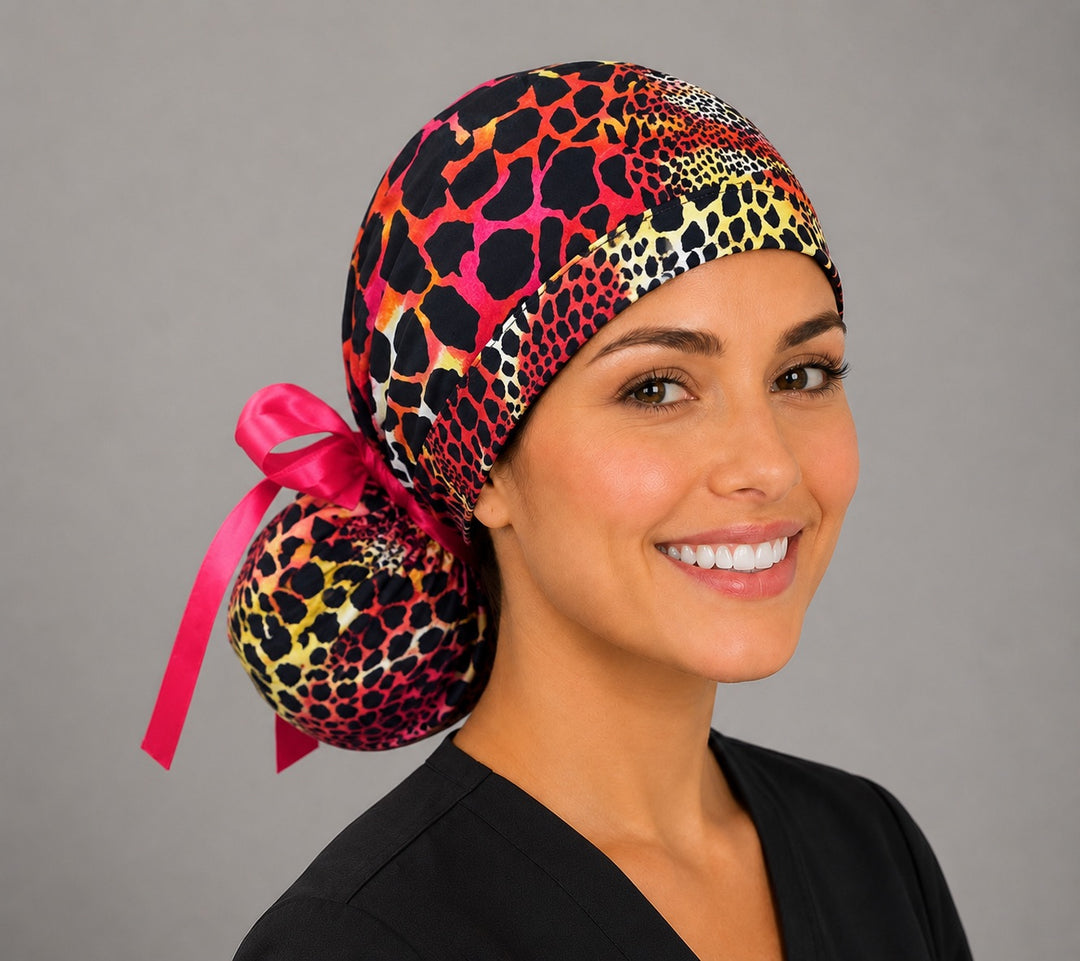 Neon cheetah leopard ponytail scrub cap left side profile showing gathered pouch of pink orange yellow leopard print with hot pink ribbon tie