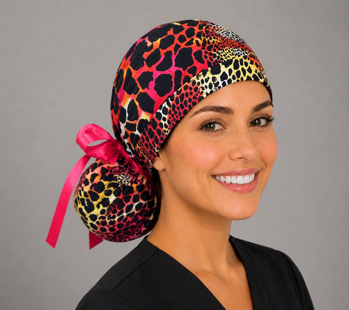 Neon cheetah leopard ponytail scrub cap left side profile showing gathered pouch of pink orange yellow leopard print with hot pink ribbon tie