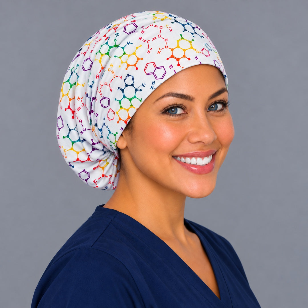 Right three-quarter angle of a chemistry molecule nurse scrub hat, with purple benzene rings and orange molecules wrapping the crown