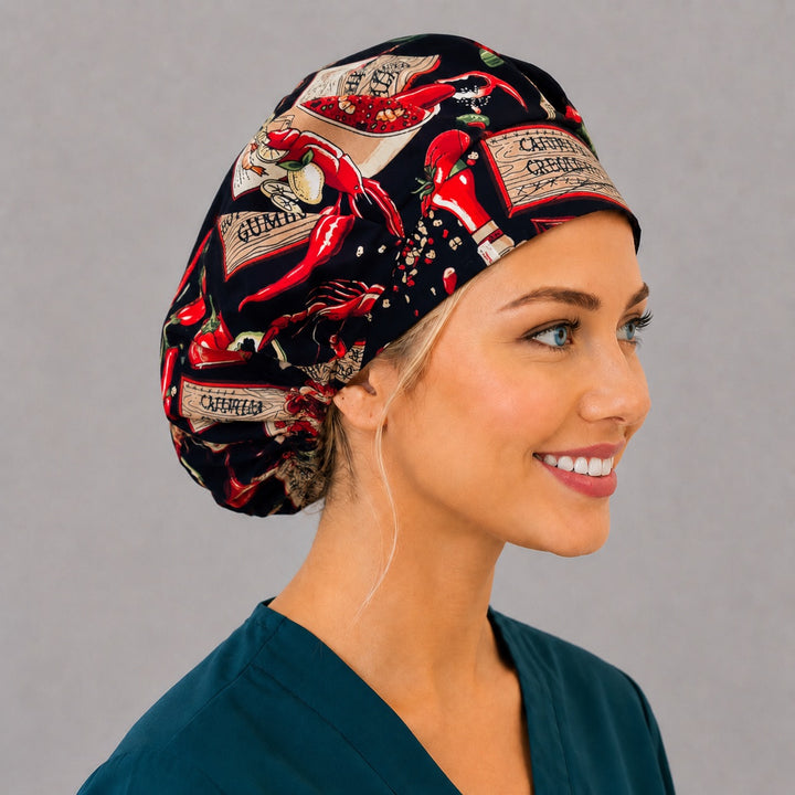 Side view of the chili pepper and hot sauce bouffant surgical cap — spicy Cajun food print on black, breathable cotton cap for nurses