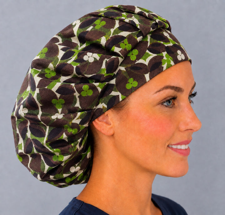 Right side profile of the chocolate mint leaf bouffant surgical hat — retro brown and lime vine print, roomy breathable cotton cap for nurses
