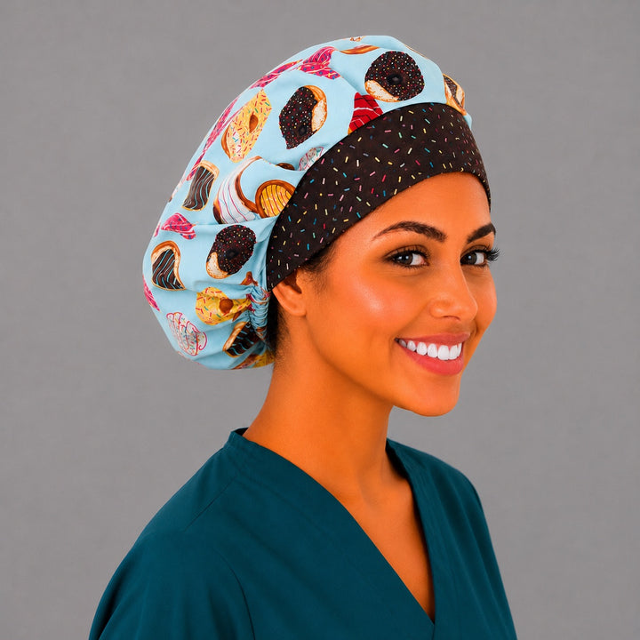 Chocolate sprinkle band bouffant scrub cap angled view — roomy bakery print cap that secures long thick hair, gift for bakers in healthcare